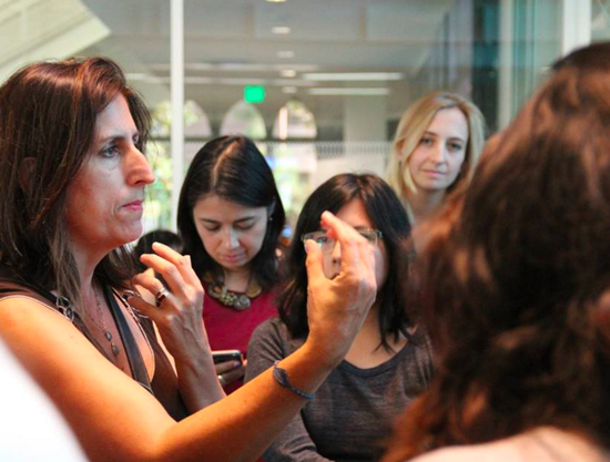 Nonny de la Pena (left) talks to students after her talk at the Women's Hackathon at USC Annenberg